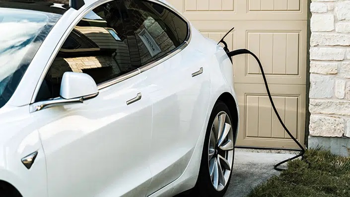 EV charging in driveway.