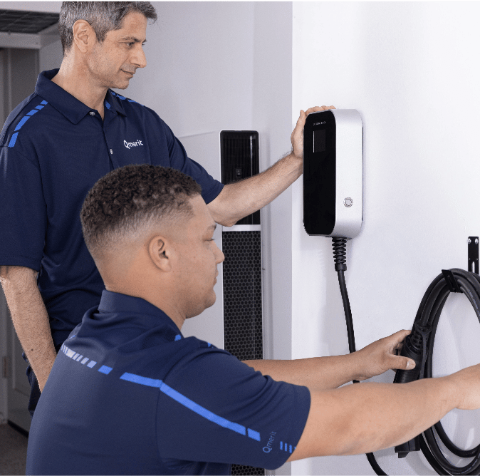 Certified electricians installing charging solution