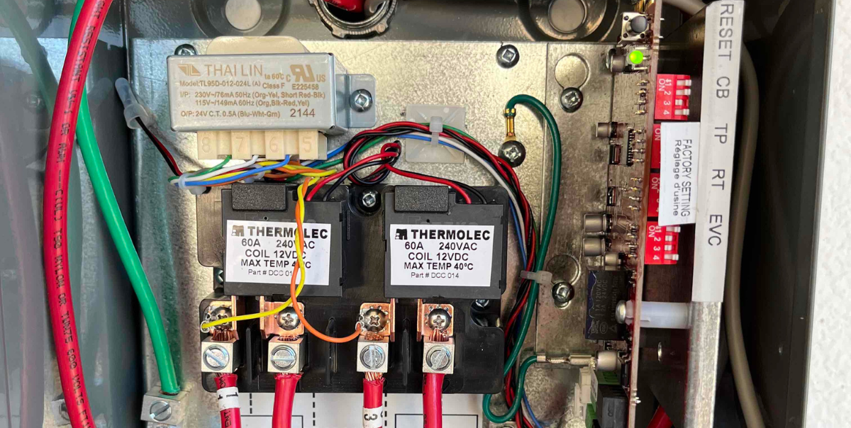 close-up image of a load shedding device as alternative for electrical contractor to install in place of a panel upgrade as cost effective savings for ev and other electrification installation services such as ev charging station
