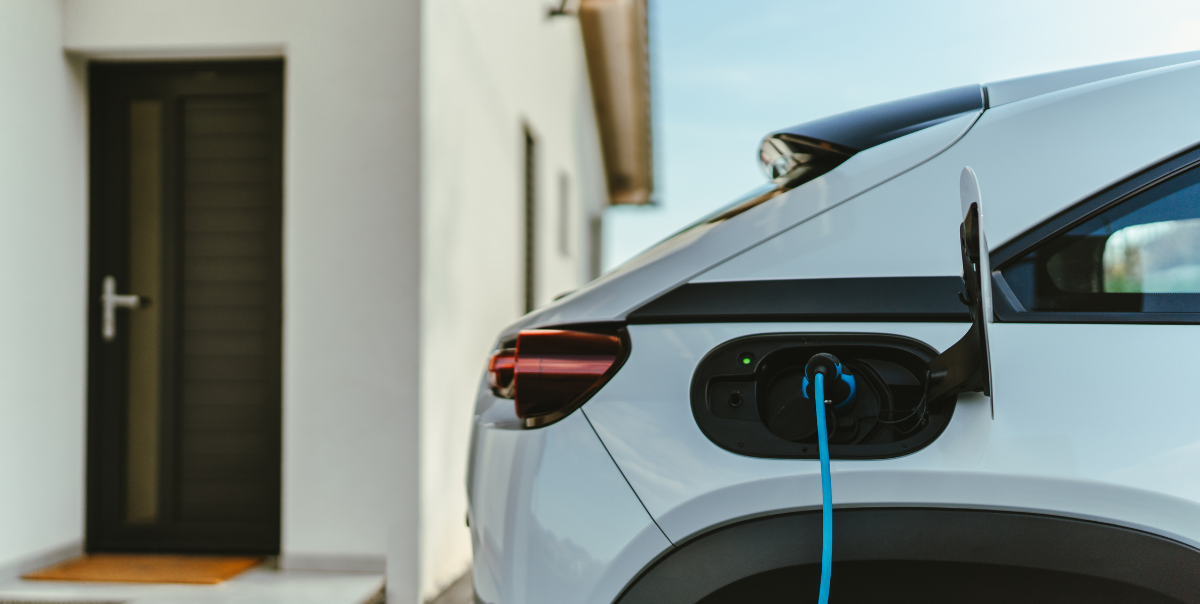 how to install an ev charger at home with at home ev charging station in house. electric vehicle is charging with level 2 ev home charging station