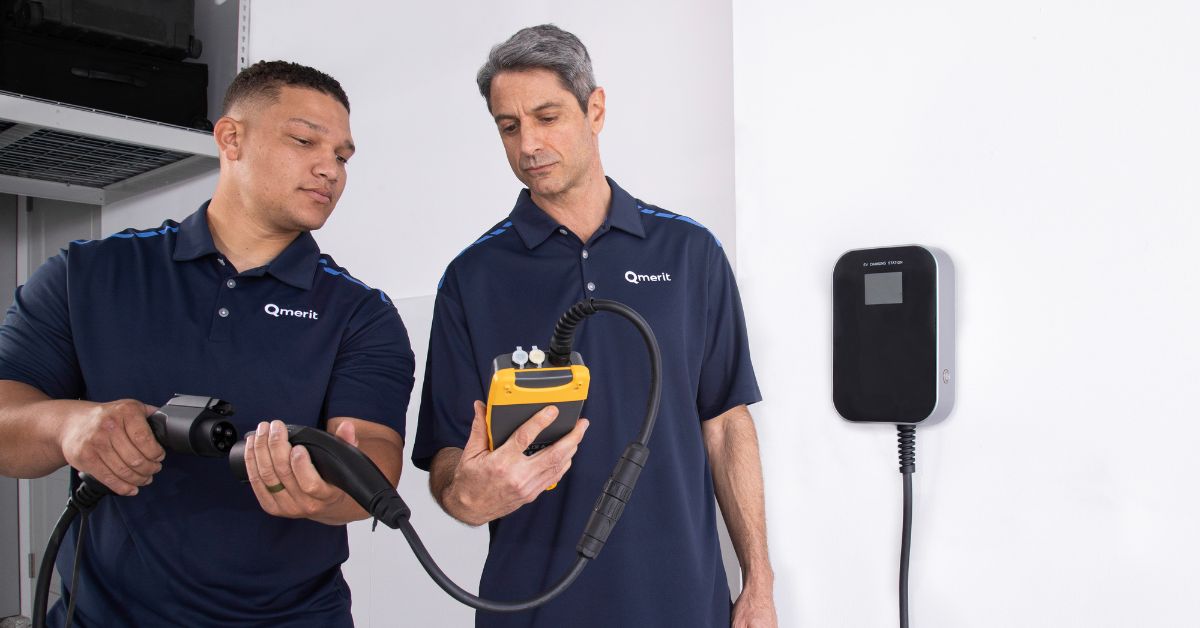 seasonal ev charger maintenance thumbnail image as two qmerit certified electrification technicians test an ev charger connection