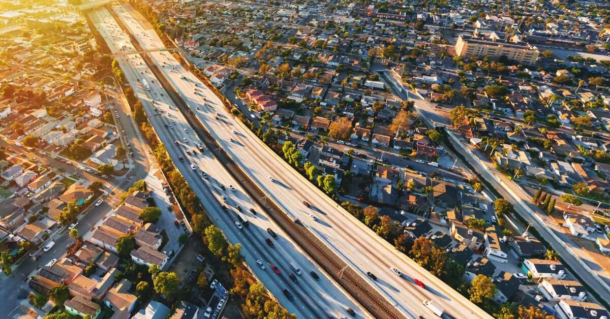 Highway traffic in Los Angeles, CA, showcasing California's EV rebate and EV charging incentive programs