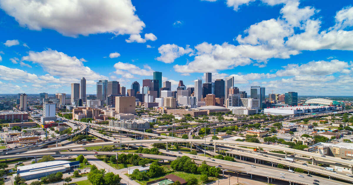 Panoramic aerial view of a vibrant cityscape showcasing the modern skyline of Texas, reflecting on the Texas EV laws.