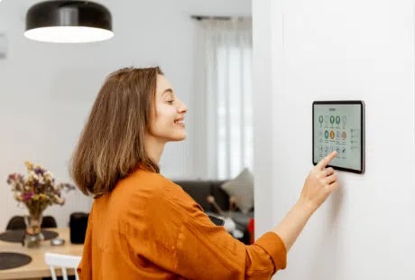 female homeowner accessing smart home device